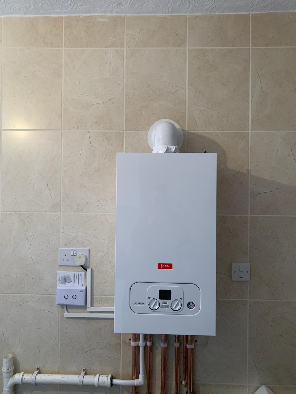 New combi boiler installation on a tiled wall, North Lincolnshire