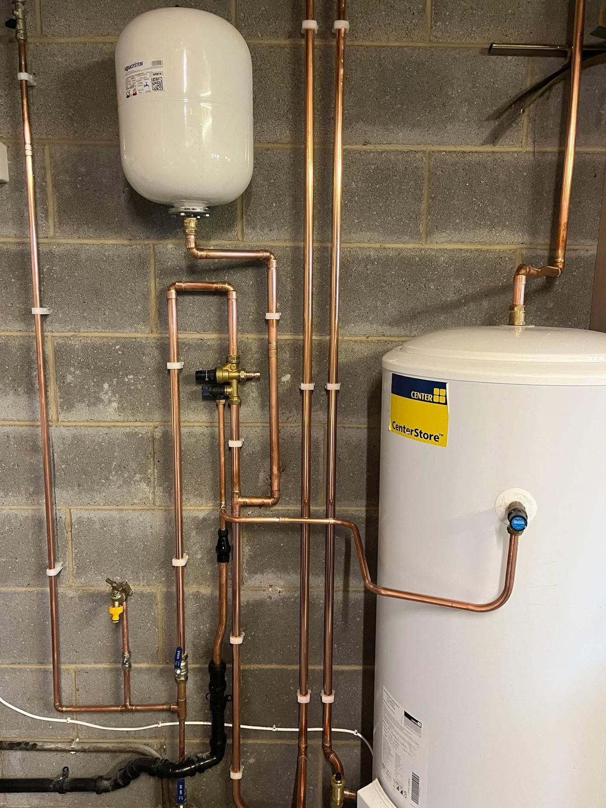 Unvented hot water cylinder with bespoke copper pipework