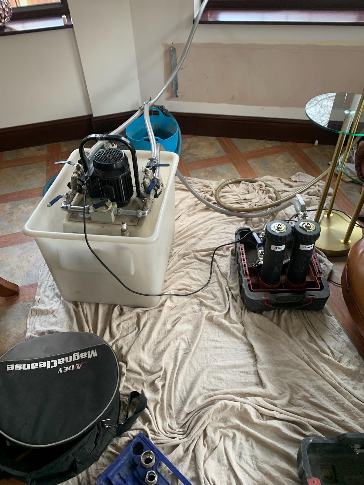 Power-flush rig set up for central heating system clean